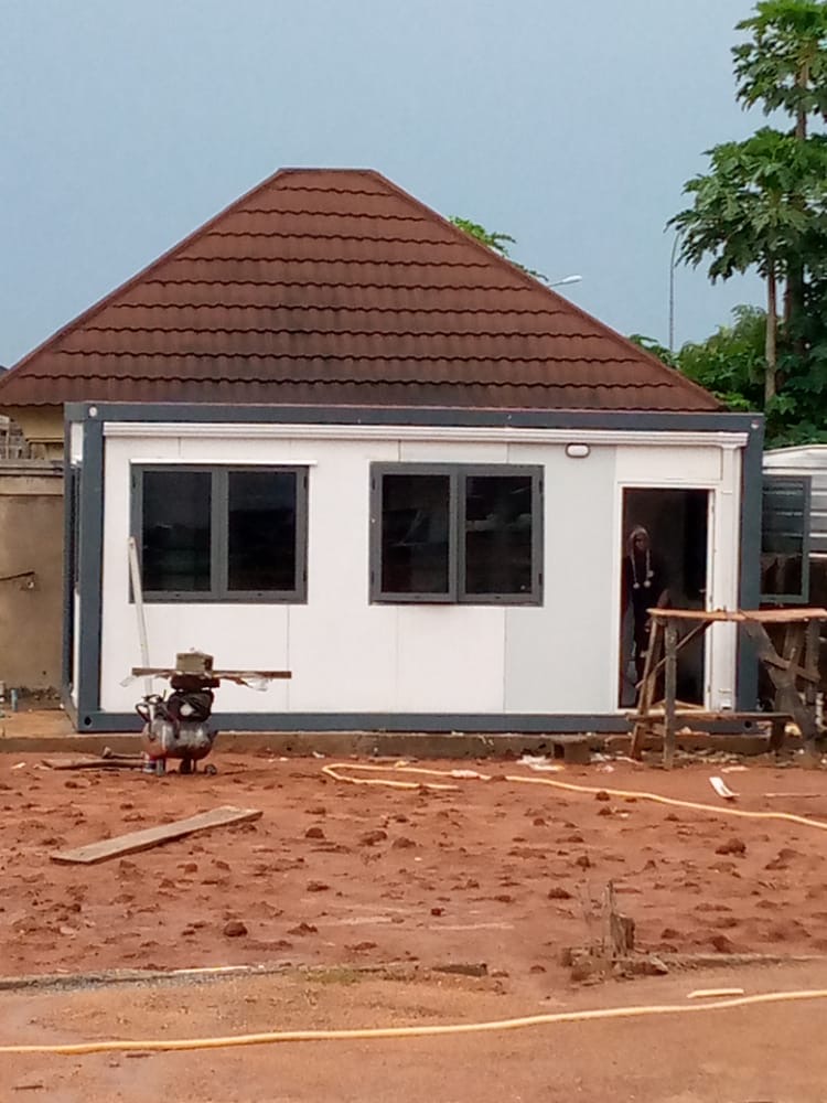 Container house finished with a stone-coated pitched roof